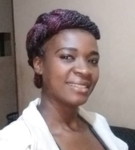 Wanangwa in a white jump suit with black blouse